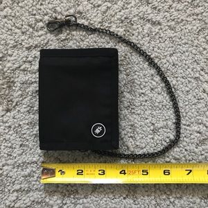 Black Pacsafe travel wallet tri-fold